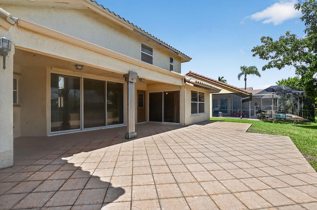 9645 Carousel Cir N, Boca Raton, FL 33434 - rear view of property with a patio, stucco siding, a tile roof, and a pool
