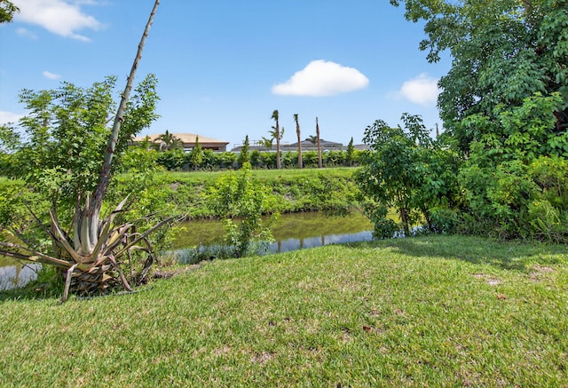 9645 Carousel Cir N, Boca Raton, FL 33434 - view of grassy yard featuring a water view