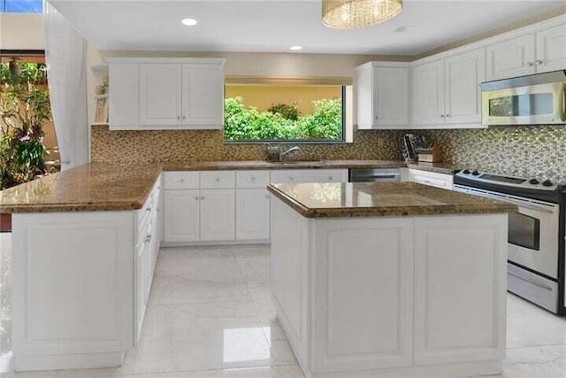 6400 Via Rosa, Boca Raton, FL 33433 - kitchen with appliances with stainless steel finishes, light marble finish floors, white cabinets, and recessed lighting