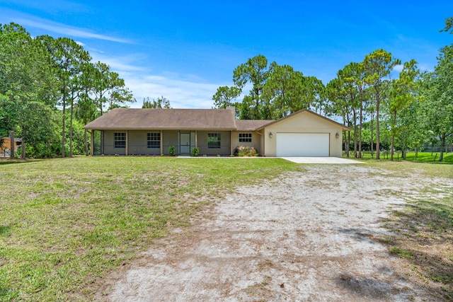 17832 43rd Rd N, Loxahatchee, FL 33470 - single story home featuring an attached garage, concrete driveway, a front lawn, and stucco siding