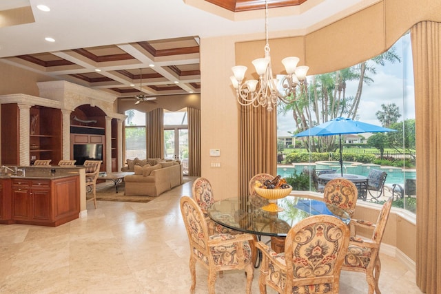 123 Grand Palm Way, Palm Beach Gardens, FL 33418 - dining area featuring ceiling fan, coffered ceiling, beamed ceiling, crown molding, and a chandelier