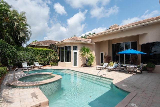 123 Grand Palm Way, Palm Beach Gardens, FL 33418 - view of pool featuring a patio and a pool with connected hot tub
