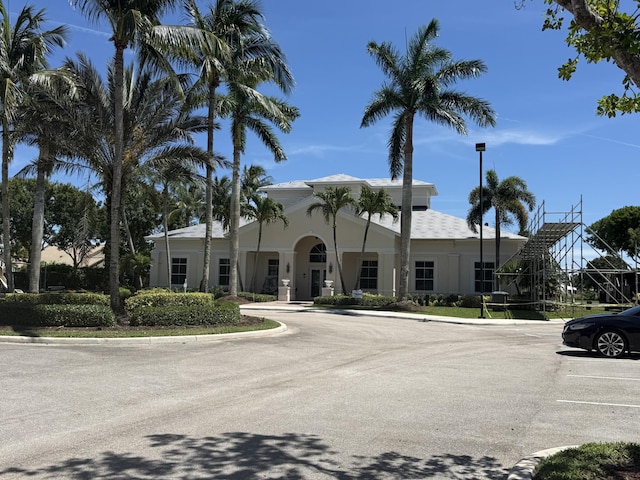 9360 Cove Point Cir, Boynton Beach, FL 33472 - view of building exterior with uncovered parking