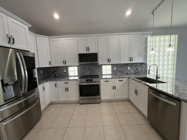 9360 Cove Point Cir, Boynton Beach, FL 33472 - kitchen featuring stainless steel appliances, tasteful backsplash, light tile patterned floors, white cabinetry, and recessed lighting