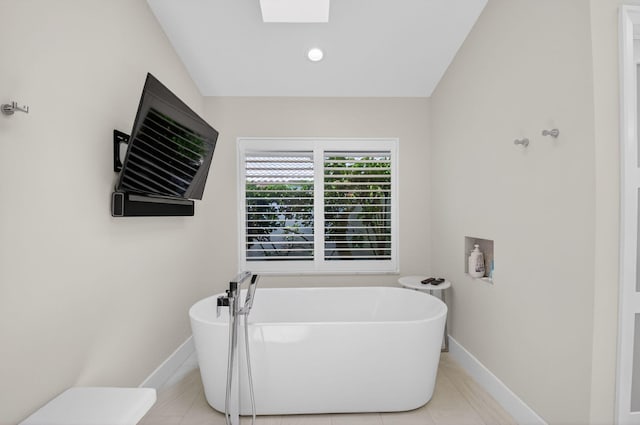 3765 Canterbury Ct, Boca Raton, FL 33434 - bathroom featuring a soaking tub and tile patterned floors