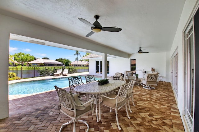 3765 Canterbury Ct, Boca Raton, FL 33434 - view of swimming pool with outdoor dining area, a fenced backyard, ceiling fan, and a patio area