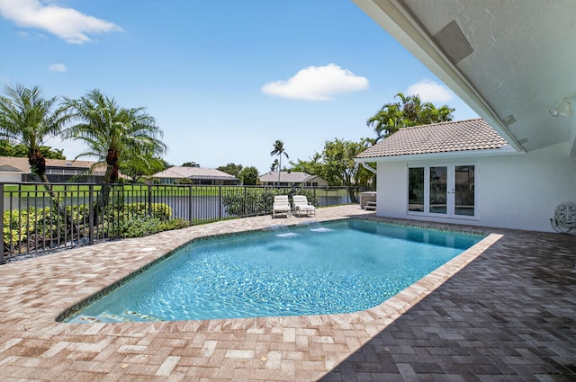 3765 Canterbury Ct, Boca Raton, FL 33434 - view of swimming pool with french doors, a fenced backyard, and a patio area