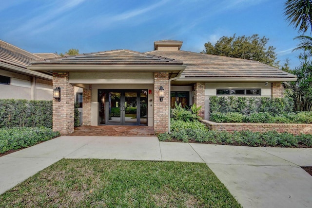 3765 Canterbury Ct, Boca Raton, FL 33434 - doorway to property with french doors and brick siding