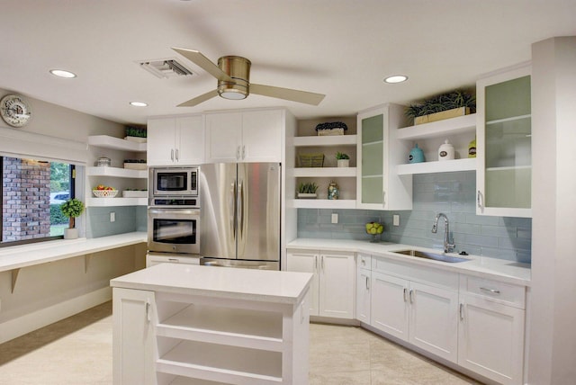 3765 Canterbury Ct, Boca Raton, FL 33434 - kitchen featuring open shelves, stainless steel appliances, light countertops, white cabinets, and recessed lighting