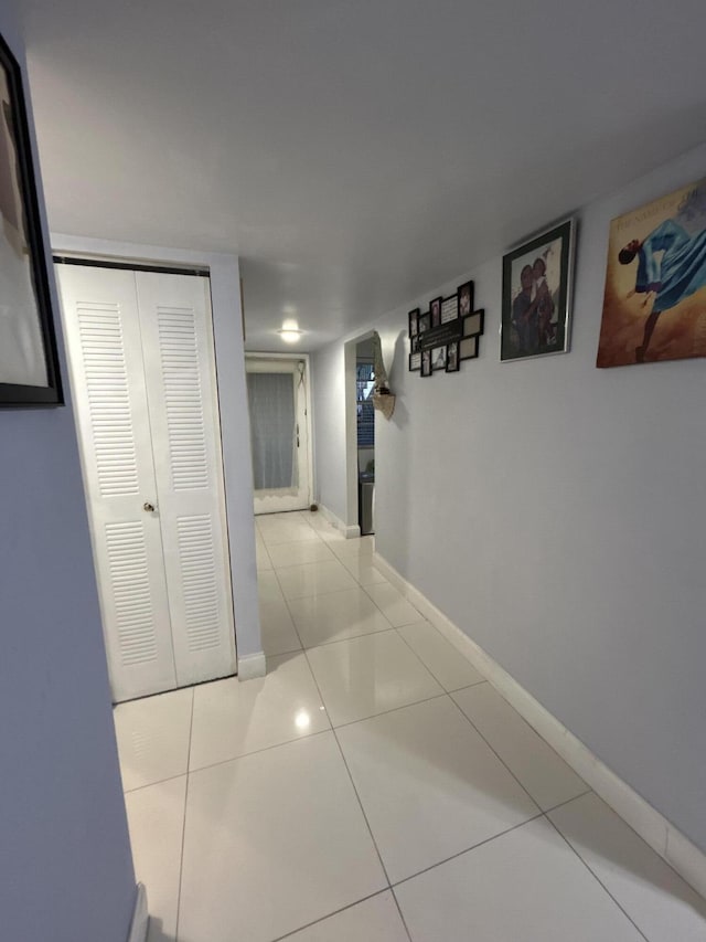 3099 NW 48th Ave Unit 163, Lauderdale Lakes, FL 33313 - hallway featuring tile patterned flooring and baseboards