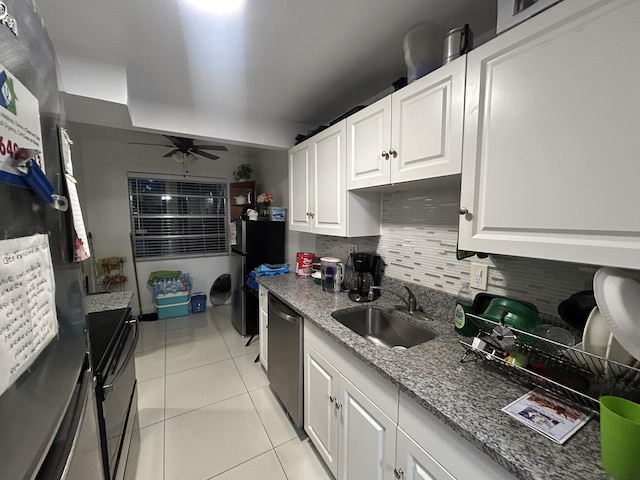 3099 NW 48th Ave Unit 163, Lauderdale Lakes, FL 33313 - kitchen with black appliances, white cabinetry, light tile patterned floors, light stone counters, and a ceiling fan