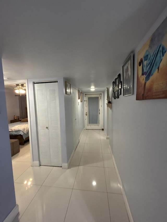 3099 NW 48th Ave Unit 163, Lauderdale Lakes, FL 33313 - hallway featuring tile patterned flooring and baseboards