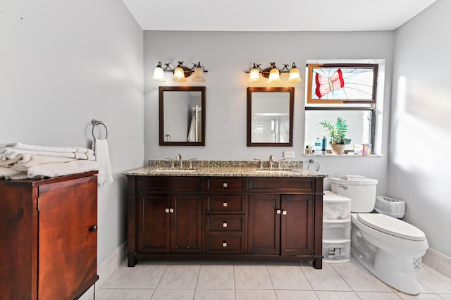 2850 NW 15th St, Delray Beach, FL 33445 - full bath featuring double vanity, baseboards, and toilet