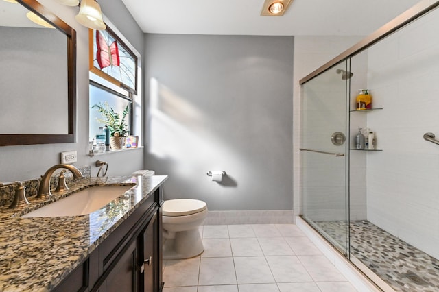 2850 NW 15th St, Delray Beach, FL 33445 - bathroom with vanity, toilet, a shower stall, and tile patterned floors