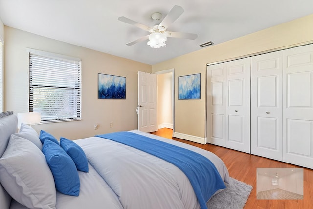2850 NW 15th St, Delray Beach, FL 33445 - bedroom featuring wood finished floors, a closet, a ceiling fan, and baseboards