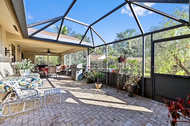 2850 NW 15th St, Delray Beach, FL 33445 - view of patio / terrace featuring area for grilling, outdoor dining space, ceiling fan, and glass enclosure