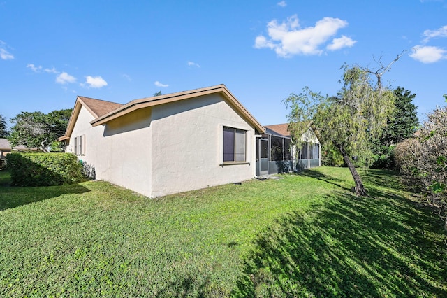 2850 NW 15th St, Delray Beach, FL 33445 - view of side of property featuring stucco siding and a yard