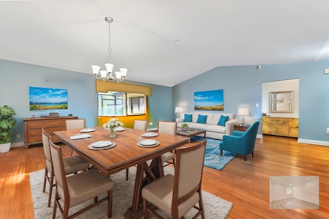 2850 NW 15th St, Delray Beach, FL 33445 - dining area featuring vaulted ceiling, light wood-type flooring, a chandelier, and baseboards