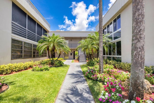 157 Capri D, Delray Beach, FL 33484 - surrounding community featuring stairs and a lawn