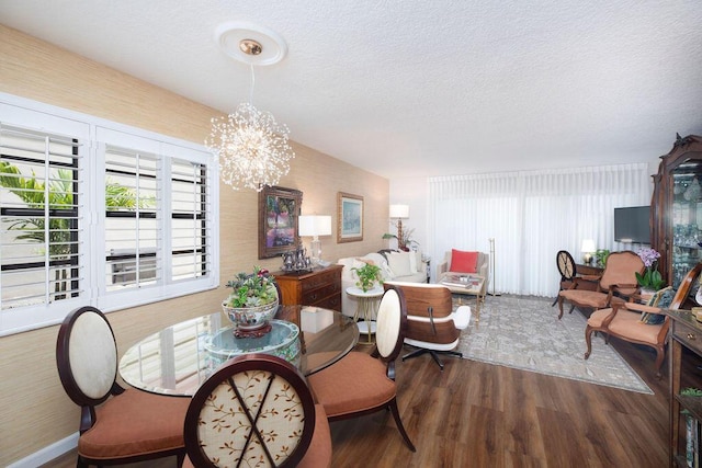 157 Capri D, Delray Beach, FL 33484 - dining area featuring wood finished floors, a chandelier, and a textured ceiling