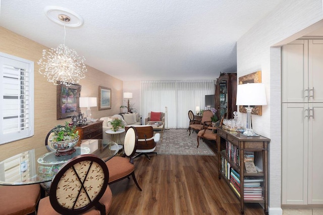 157 Capri D, Delray Beach, FL 33484 - dining area with wood finished floors, a chandelier, and a textured ceiling