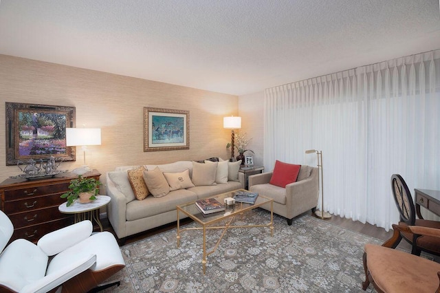 157 Capri D, Delray Beach, FL 33484 - living room featuring a textured ceiling and wood finished floors