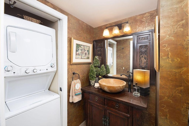 157 Capri D, Delray Beach, FL 33484 - bathroom featuring stacked washing machine and dryer and vanity