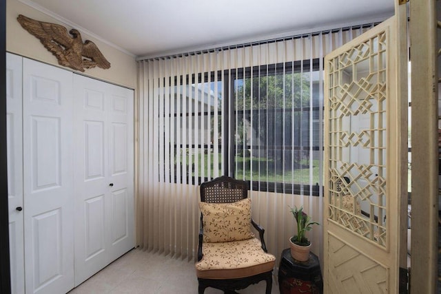 157 Capri D, Delray Beach, FL 33484 - sitting room with light tile patterned floors and crown molding