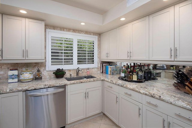 157 Capri D, Delray Beach, FL 33484 - kitchen featuring dishwasher, recessed lighting, tasteful backsplash, white cabinets, and light tile patterned floors