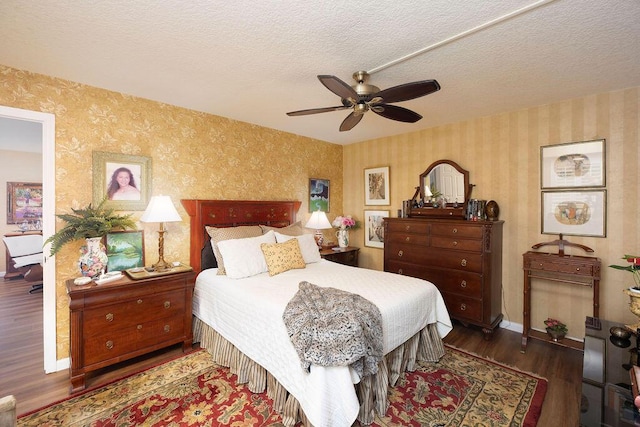 157 Capri D, Delray Beach, FL 33484 - bedroom featuring wallpapered walls, wood finished floors, a textured ceiling, and a ceiling fan