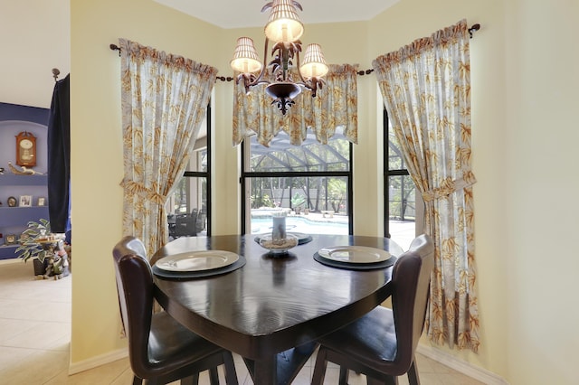 3429 SW Catskill Dr, Port Saint Lucie, FL 34953 - tiled dining space with a chandelier and baseboards