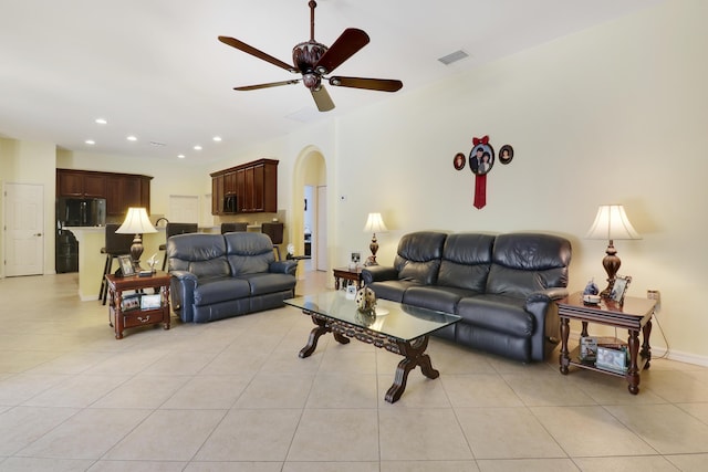 3429 SW Catskill Dr, Port Saint Lucie, FL 34953 - living room featuring ceiling fan, arched walkways, light tile patterned flooring, and recessed lighting