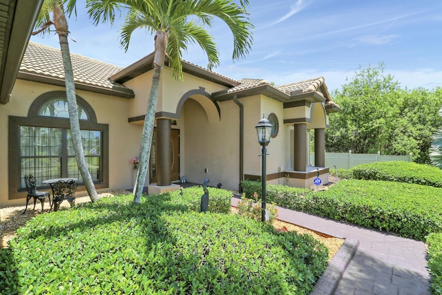 3429 SW Catskill Dr, Port Saint Lucie, FL 34953 - entrance to property with a tile roof and stucco siding