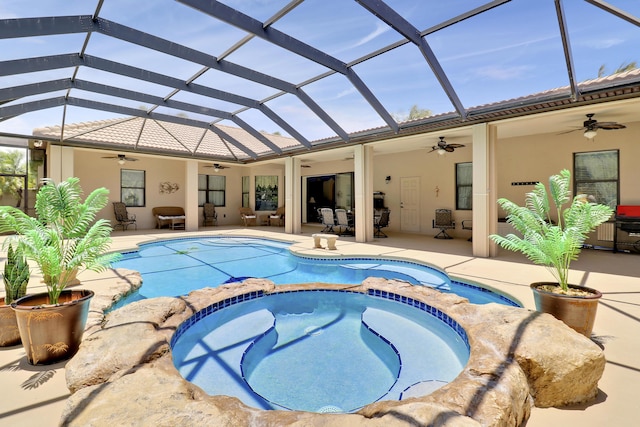 3429 SW Catskill Dr, Port Saint Lucie, FL 34953 - view of pool with a ceiling fan, a pool with connected hot tub, a patio, glass enclosure, and outdoor dining space