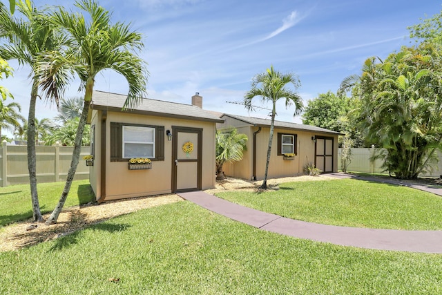 3429 SW Catskill Dr, Port Saint Lucie, FL 34953 - ranch-style home featuring an outdoor structure and a chimney