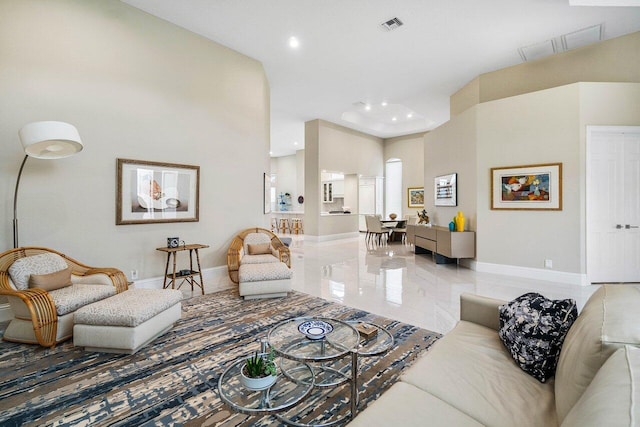 391 Isle Ct, Palm Beach Gardens, FL 33418 - living room with recessed lighting and a towering ceiling