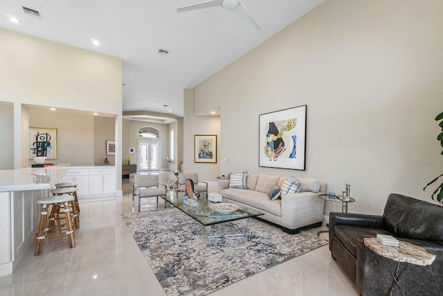 391 Isle Ct, Palm Beach Gardens, FL 33418 - living room with a ceiling fan, recessed lighting, and a towering ceiling
