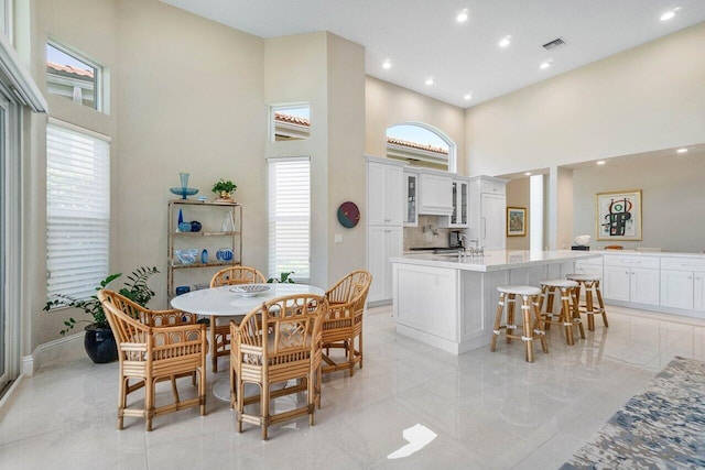 391 Isle Ct, Palm Beach Gardens, FL 33418 - dining space with a towering ceiling, plenty of natural light, and recessed lighting