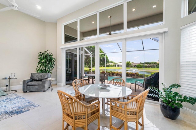391 Isle Ct, Palm Beach Gardens, FL 33418 - dining room with a sunroom, a ceiling fan, healthy amount of natural light, recessed lighting, and a high ceiling
