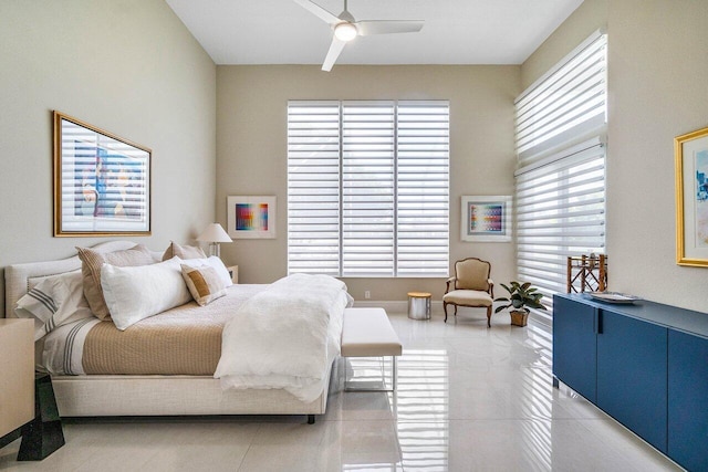 391 Isle Ct, Palm Beach Gardens, FL 33418 - bedroom with light tile patterned floors and ceiling fan