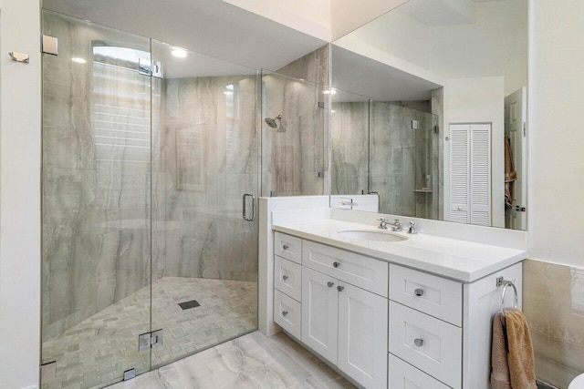 391 Isle Ct, Palm Beach Gardens, FL 33418 - bathroom featuring a stall shower, vanity, and marble finish floors