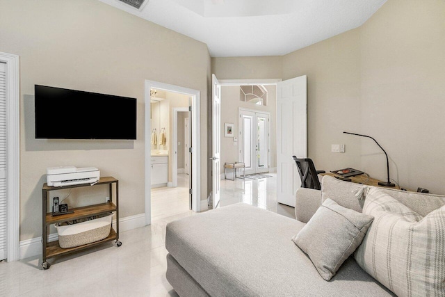 391 Isle Ct, Palm Beach Gardens, FL 33418 - bedroom with light tile patterned floors and ensuite bath