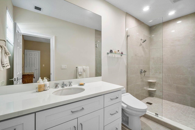 391 Isle Ct, Palm Beach Gardens, FL 33418 - bathroom with tiled shower, vanity, tile patterned flooring, and recessed lighting