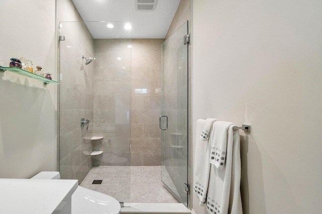 391 Isle Ct, Palm Beach Gardens, FL 33418 - bathroom featuring a shower stall, vanity, and recessed lighting
