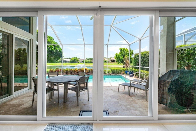 391 Isle Ct, Palm Beach Gardens, FL 33418 - doorway with a sunroom and a water view