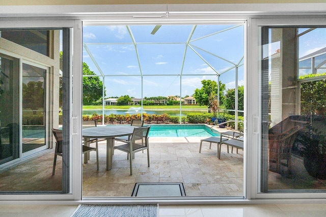 391 Isle Ct, Palm Beach Gardens, FL 33418 - outdoor pool featuring a patio area, a water view, and glass enclosure