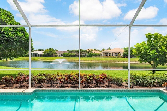 391 Isle Ct, Palm Beach Gardens, FL 33418 - view of swimming pool featuring a water view, a lawn, and a lanai