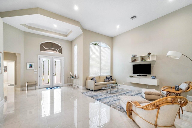 391 Isle Ct, Palm Beach Gardens, FL 33418 - living room with french doors, recessed lighting, and a high ceiling