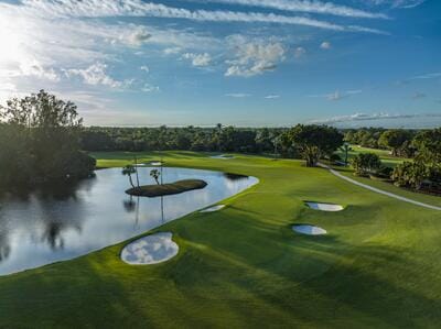 391 Isle Ct, Palm Beach Gardens, FL 33418 - surrounding community featuring a water view, view of golf course, and a lawn