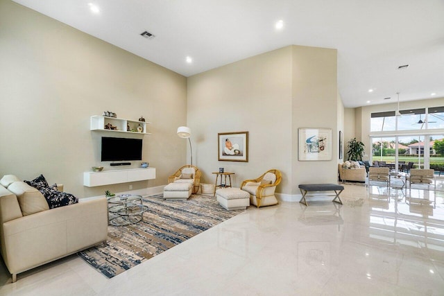 391 Isle Ct, Palm Beach Gardens, FL 33418 - living room featuring a towering ceiling and recessed lighting